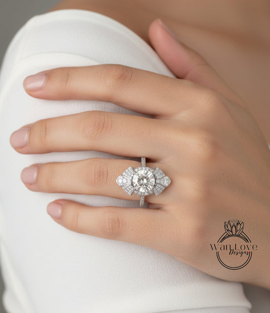 A close-up of a person's hand wearing a large, sparkling diamond ring on the ring finger.