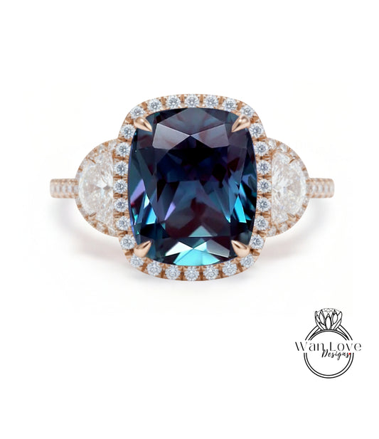 A large, blue gemstone ring with a halo of smaller diamonds around the center stone.