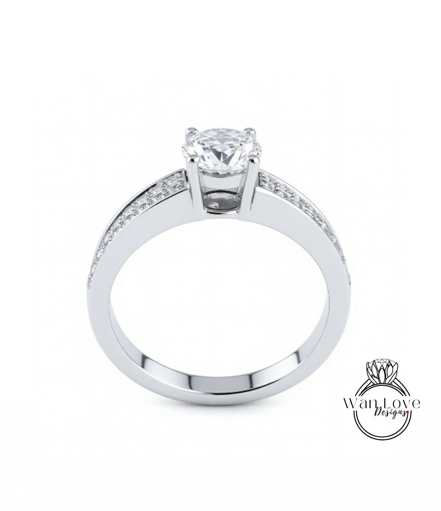 A silver engagement ring with a large central diamond and smaller diamonds along the band.