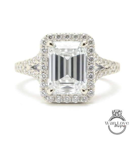A stunning diamond engagement ring with a large, brilliant-cut diamond set in a halo of smaller diamonds, surrounded by a sparkling bezel.