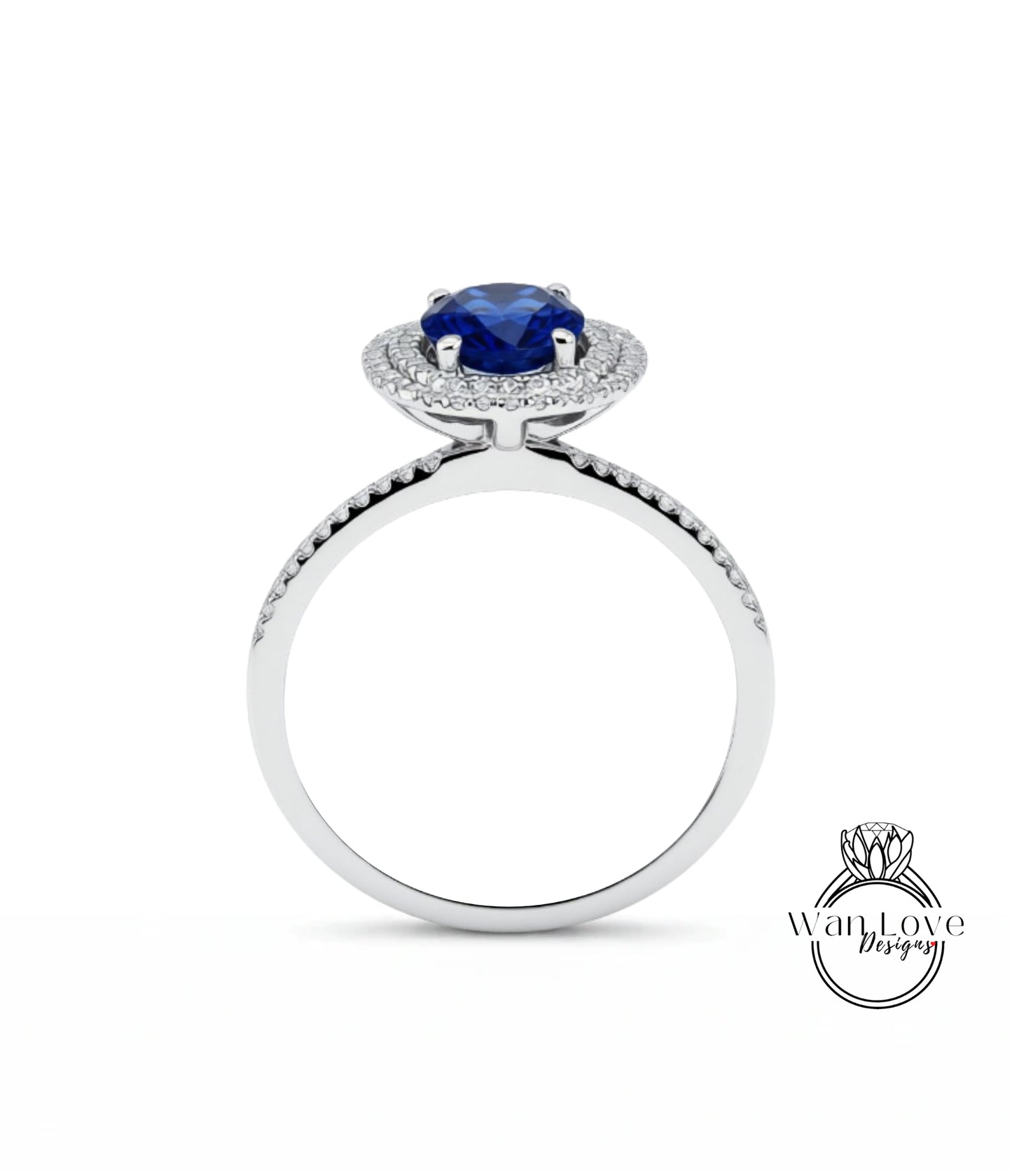 A silver ring with a large blue gemstone at the center, surrounded by smaller diamonds.