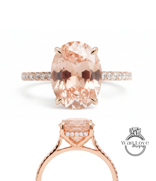 a beautiful pink gemstone engagement ring with a large oval-shaped gemstone set in a gold band.