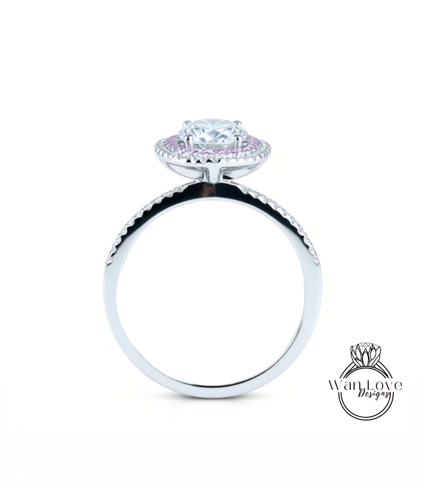 A silver engagement ring with a large central diamond surrounded by smaller diamonds, set in a halo of smaller diamonds.