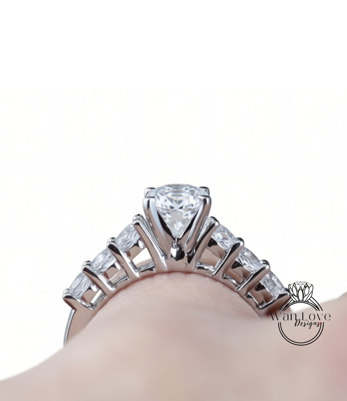 A close-up view of a diamond engagement ring on a person's hand, showcasing the intricate design and sparkling gemstone.
