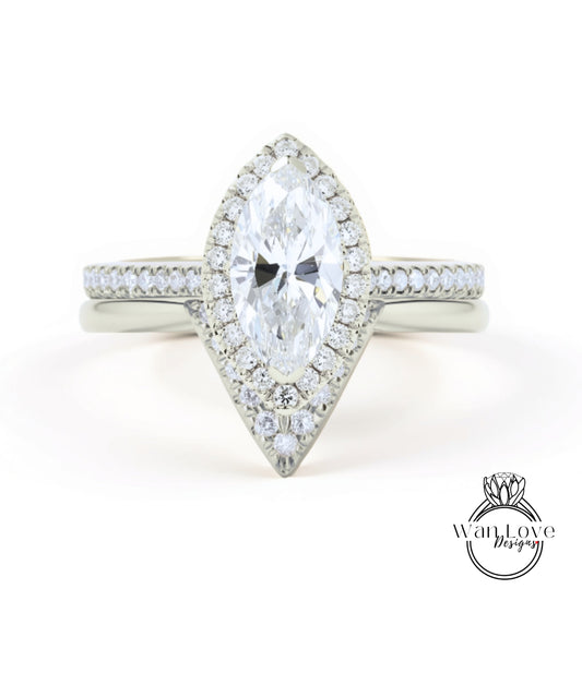 A close-up view of a diamond engagement ring with a large central diamond surrounded by smaller diamonds on the band.