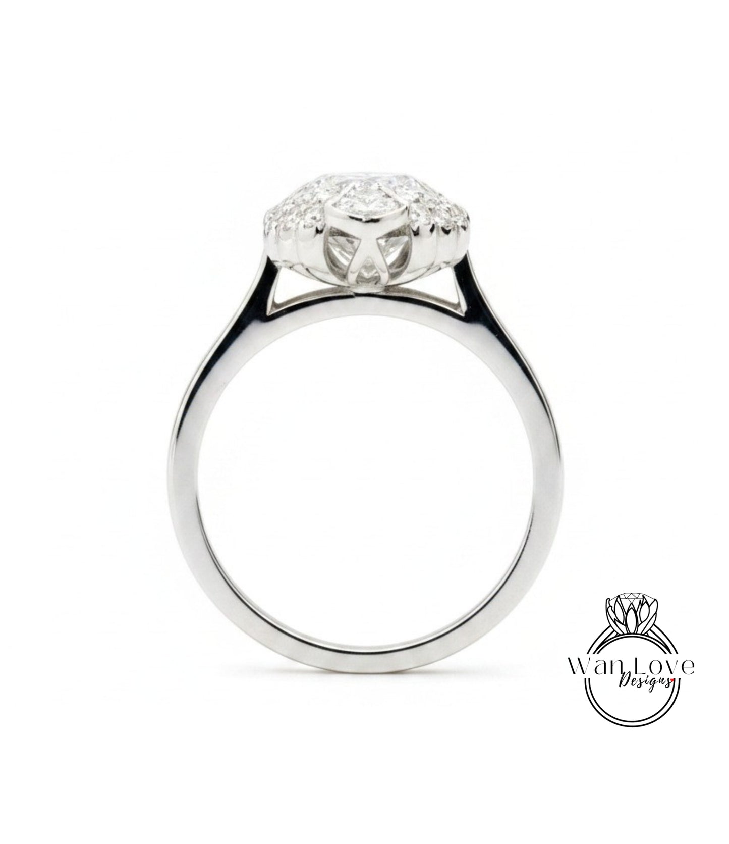 A silver engagement ring with a large central diamond surrounded by smaller diamonds.