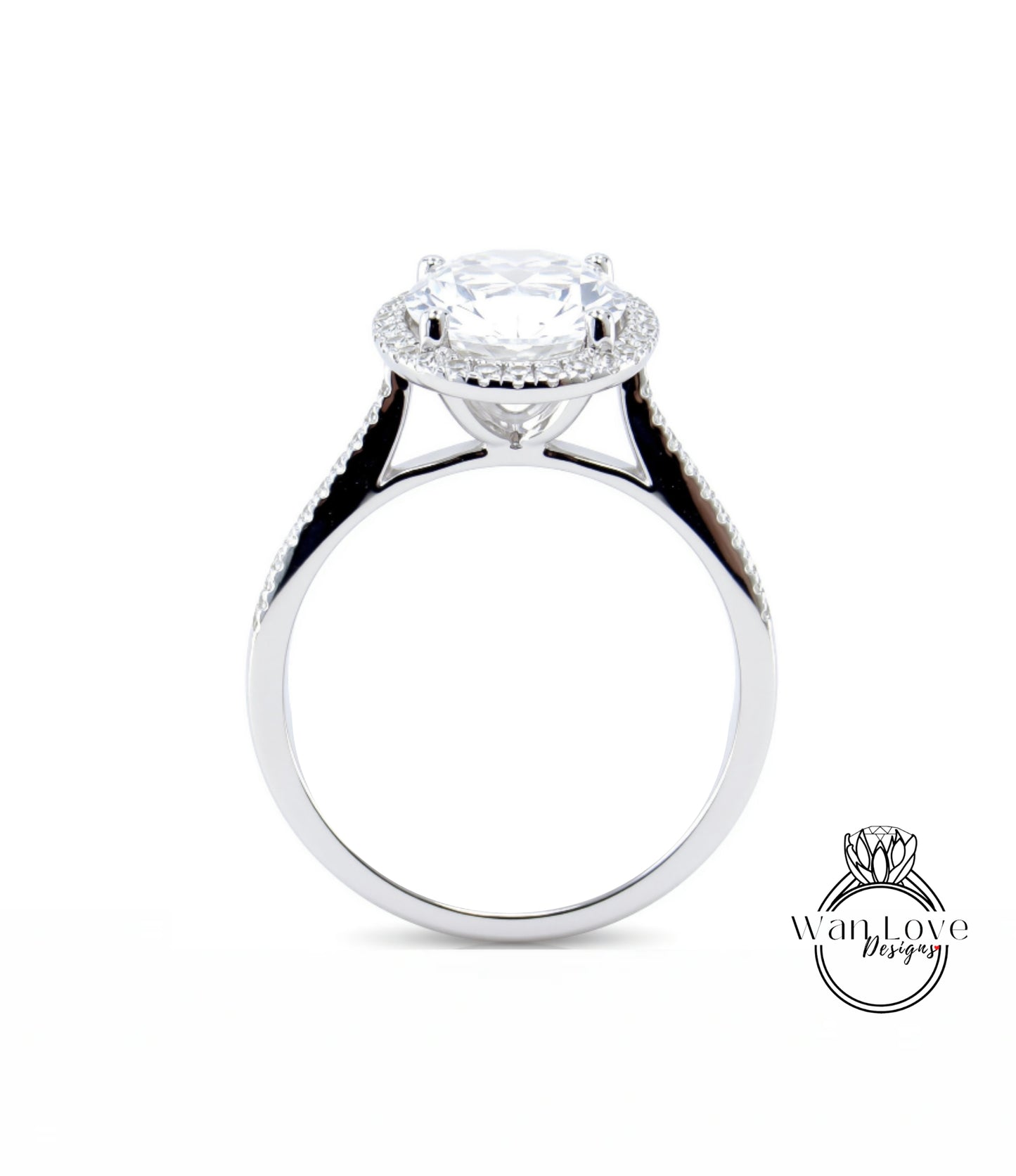 A close-up of a silver engagement ring with a large, round diamond at the center, surrounded by smaller diamonds.