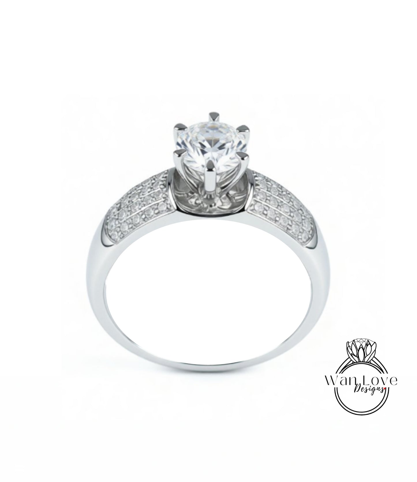 A silver ring with a large central diamond and smaller diamonds on either side.