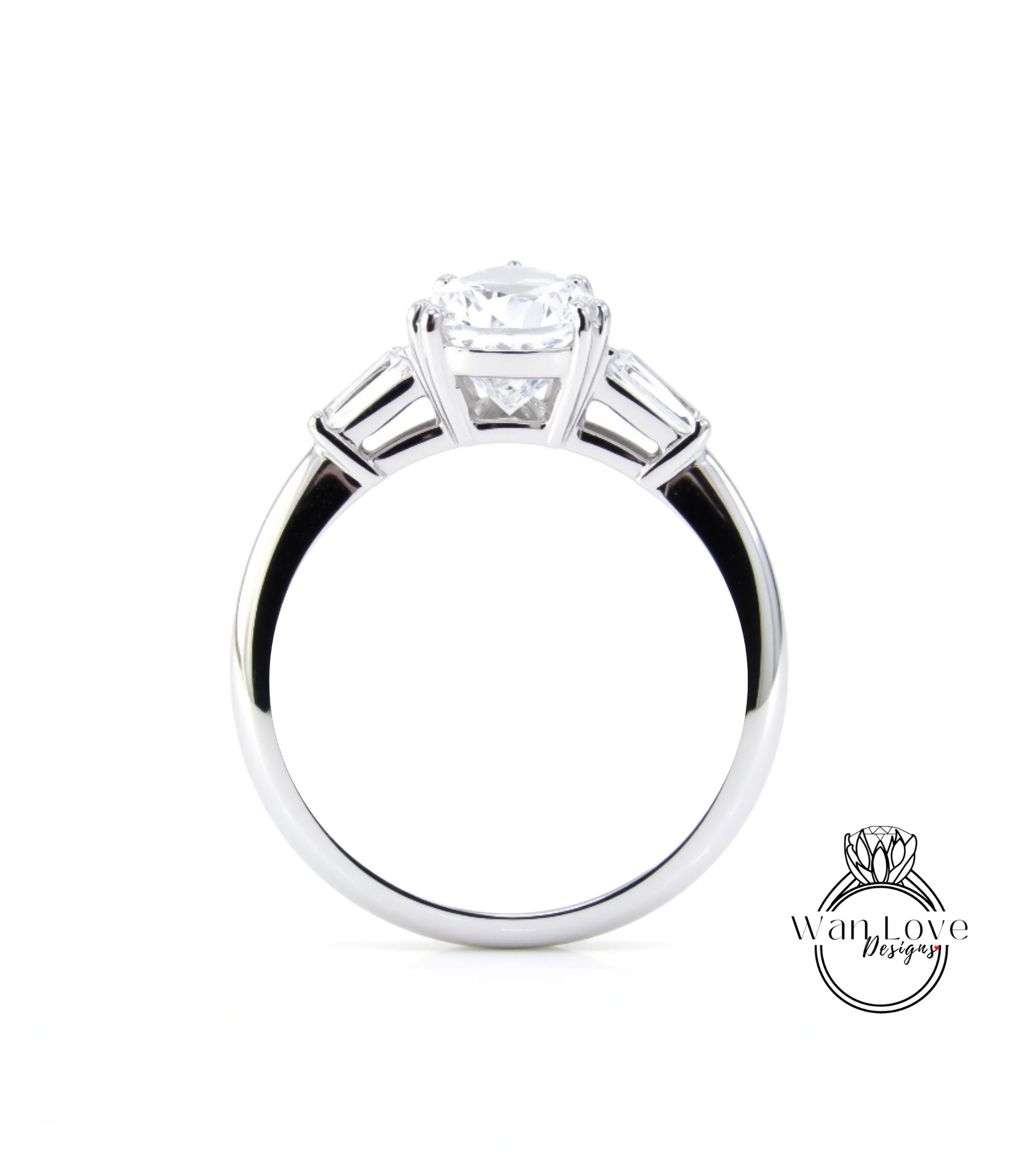 A close-up view of a silver engagement ring with a large central diamond and three smaller diamonds on either side.