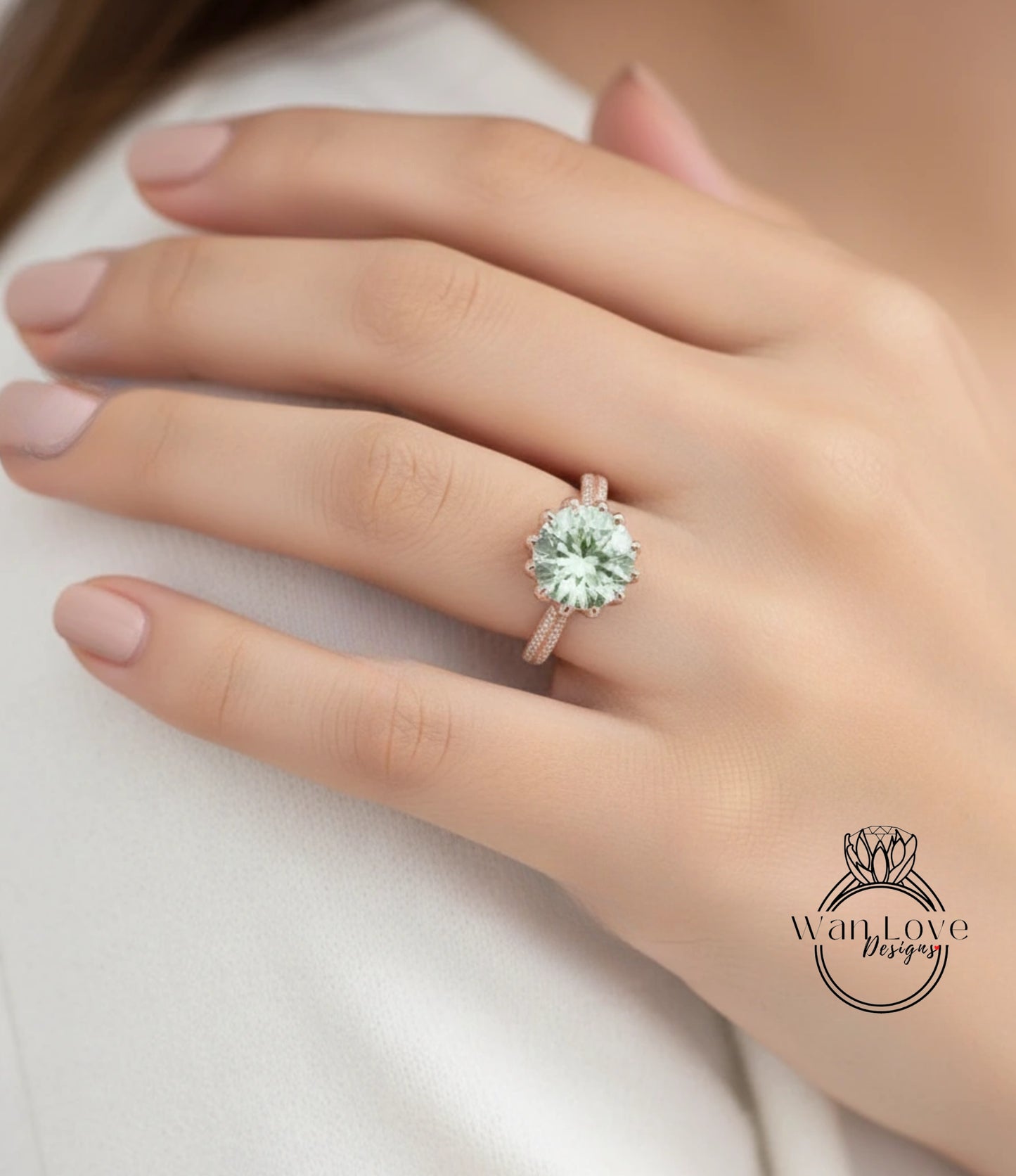 A close-up of a person's hand wearing a large, greenish-green diamond ring with a delicate band.