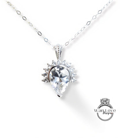A necklace with a large, clear gemstone pendant, which appears to be a diamond or crystal.