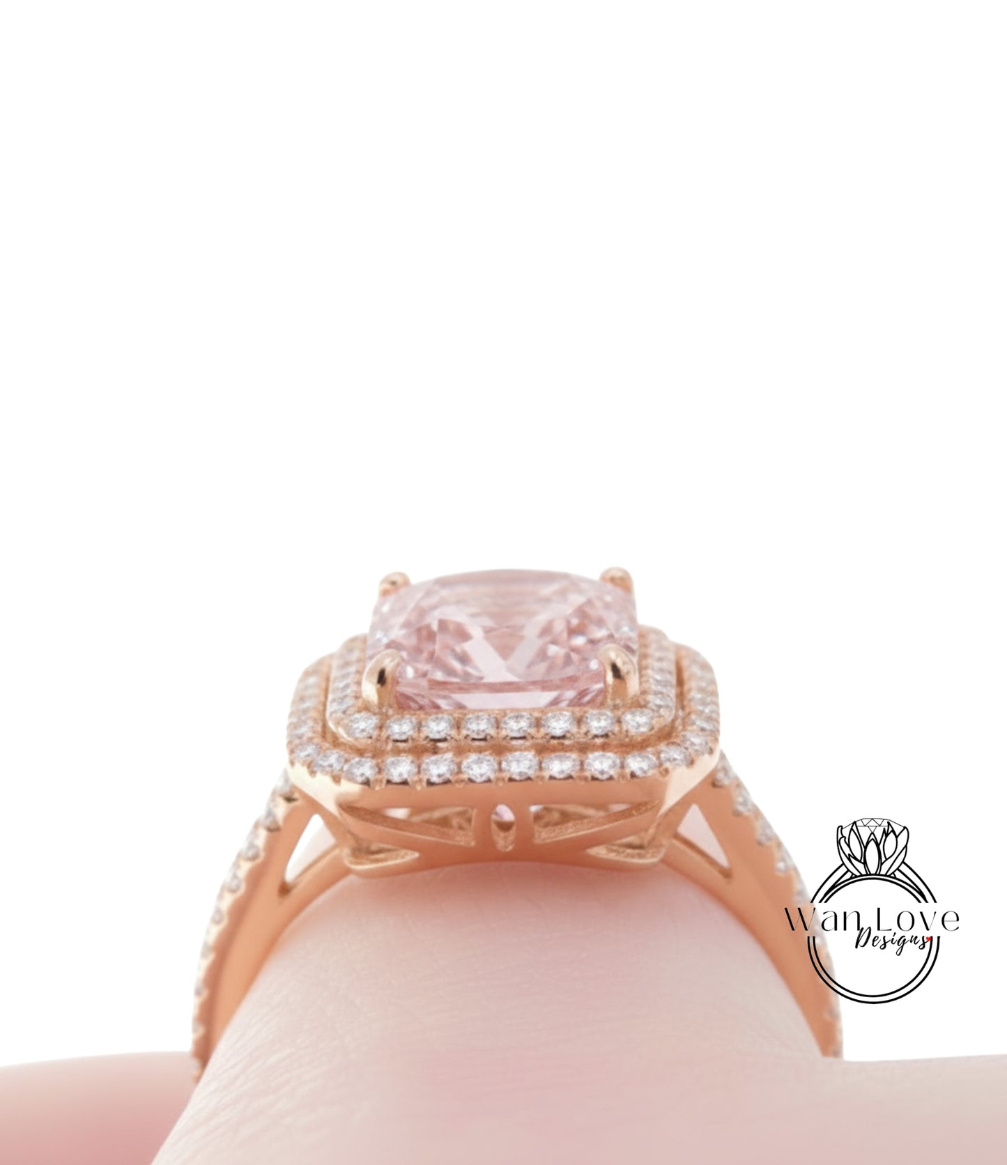 A close-up view of a gold ring with a large pink gemstone, showcasing the intricate design and sparkling details.