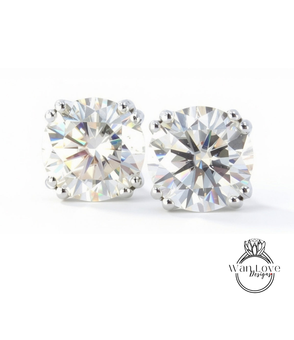 two large, clear, and brilliant-cut diamonds set in silver earrings.