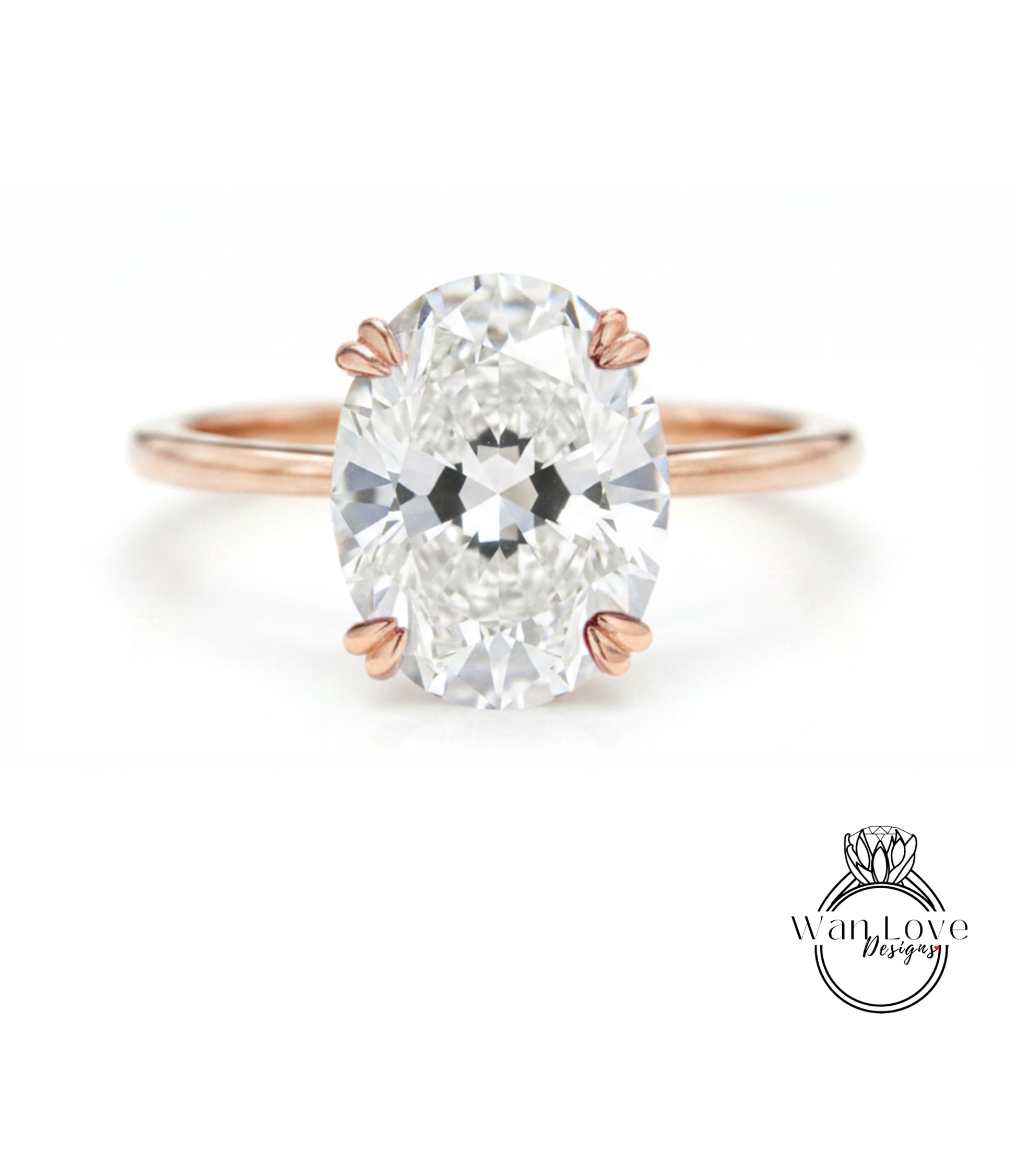 A close-up of a diamond engagement ring with a large oval-shaped diamond set in a rose gold band.