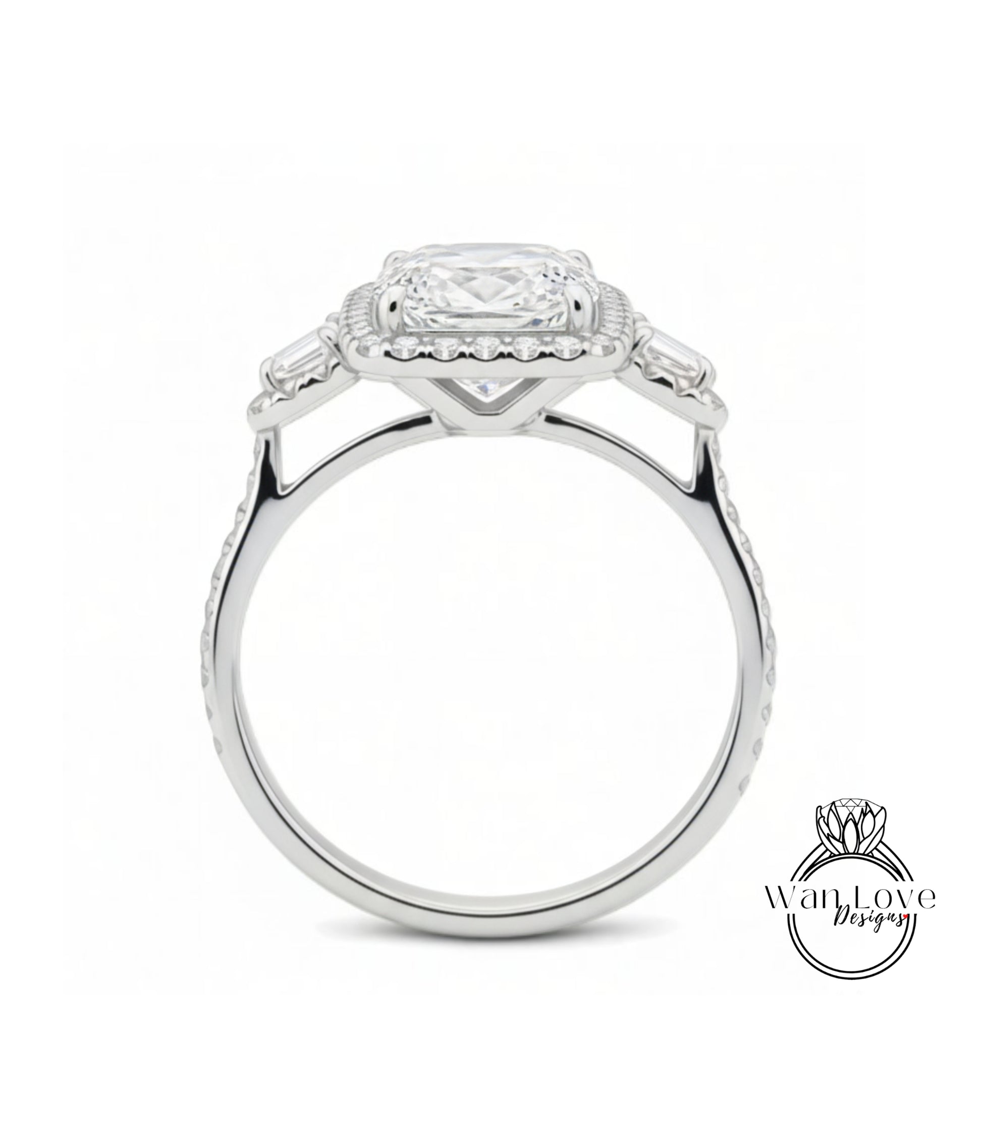 A silver engagement ring with a large central diamond surrounded by smaller diamonds on either side.