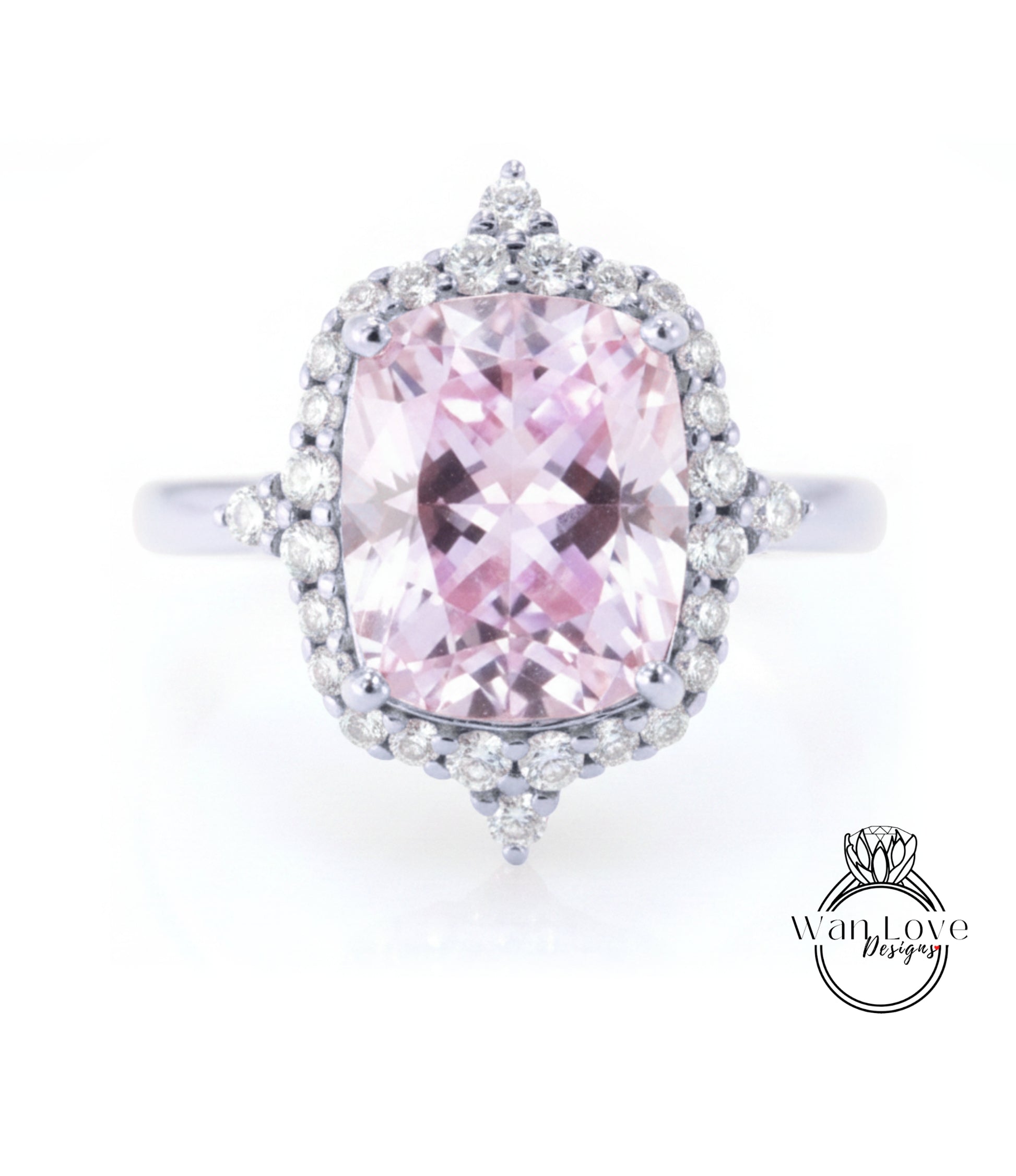 A stunning pink gemstone ring with a halo of sparkling diamonds around it.