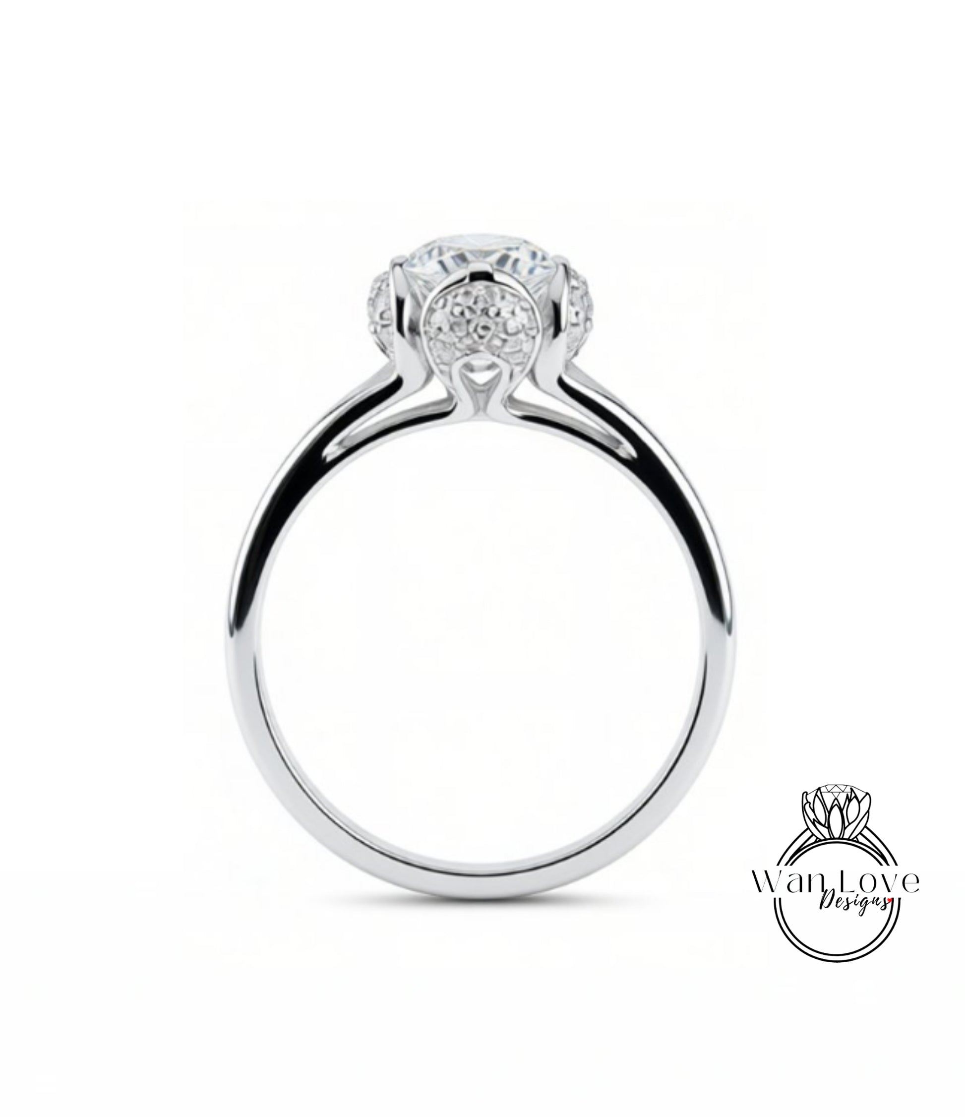A silver engagement ring with a large central diamond surrounded by smaller diamonds.
