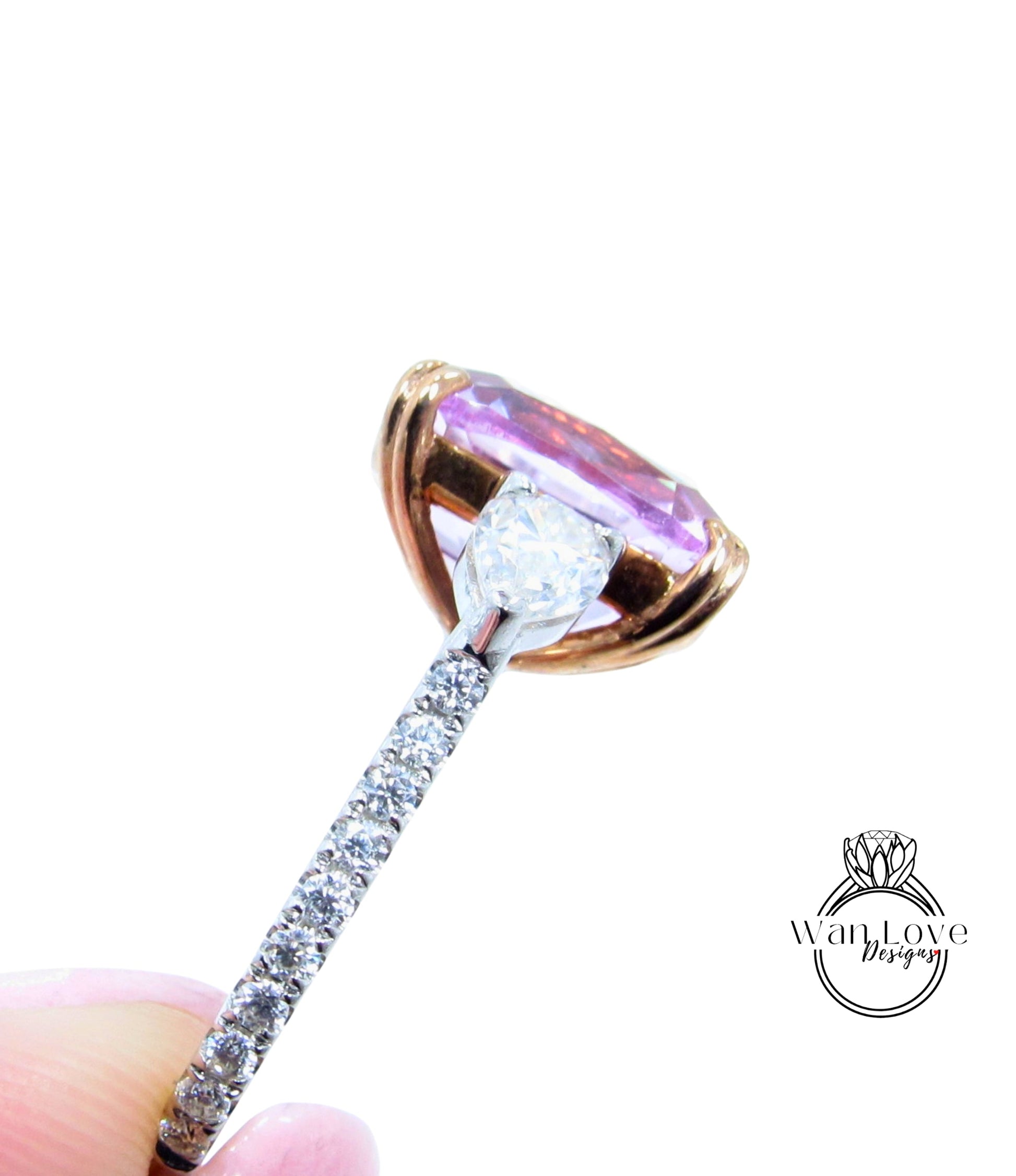 A close-up view of a diamond engagement ring with a large, clear gemstone set in a gold-toned band.