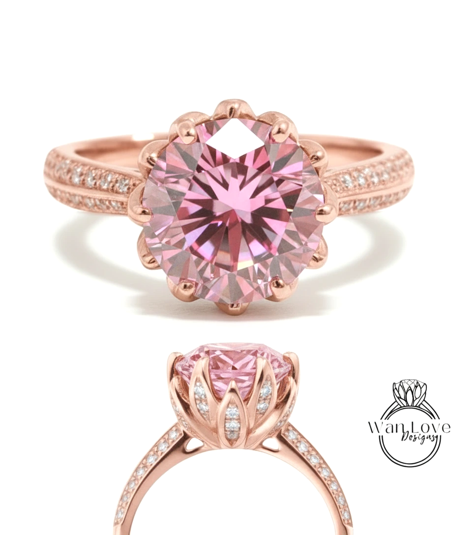 a beautiful pink diamond engagement ring with a large central diamond surrounded by smaller diamonds on the band.