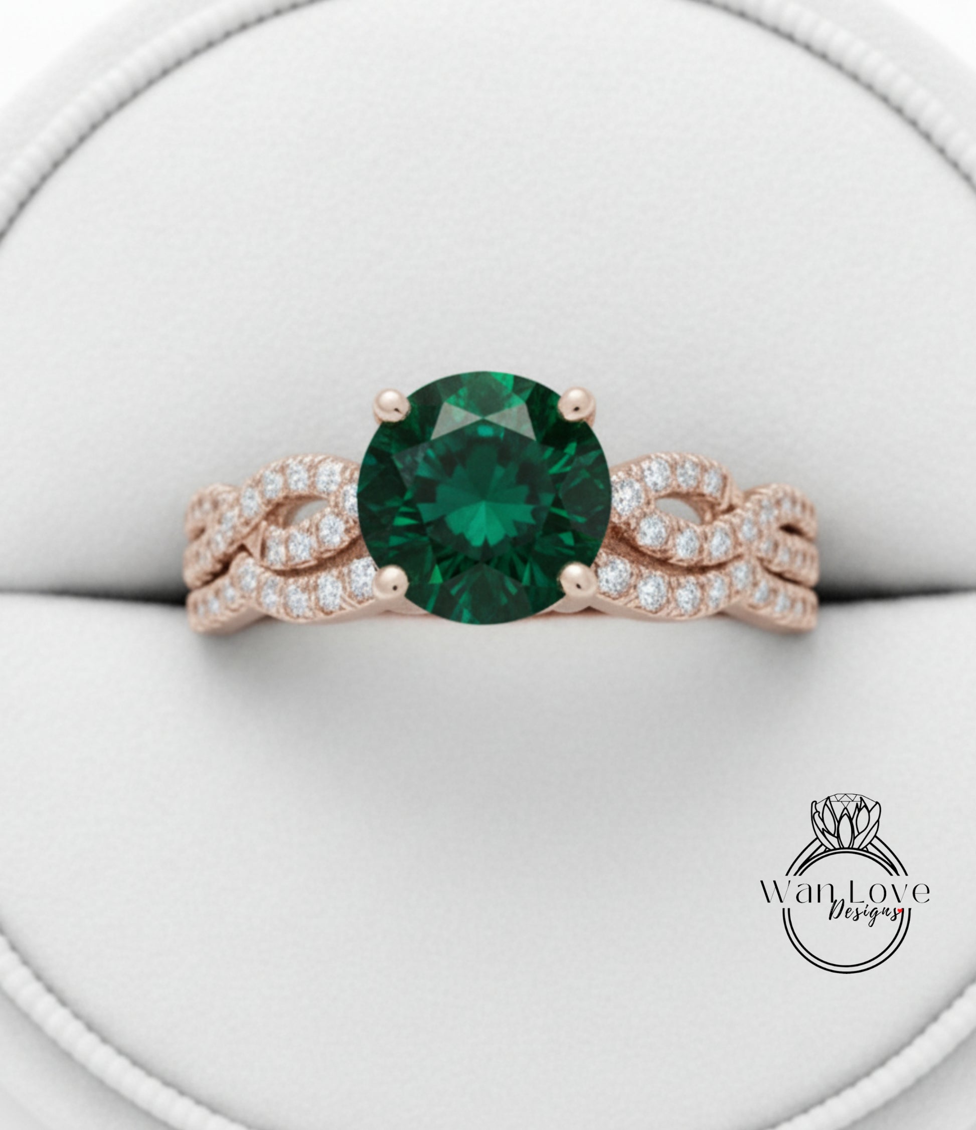 A close-up view of a gold ring with a large green gemstone, showcasing the intricate design and craftsmanship.