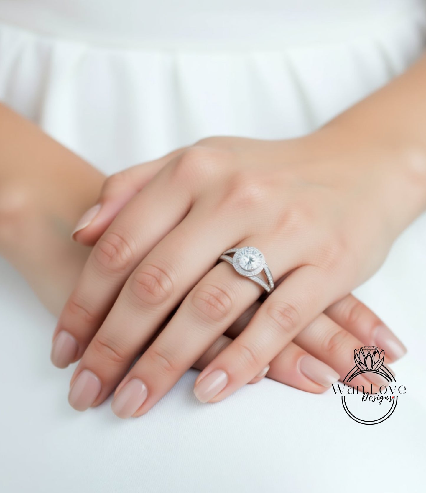A close-up of a person's hands wearing a diamond engagement ring.