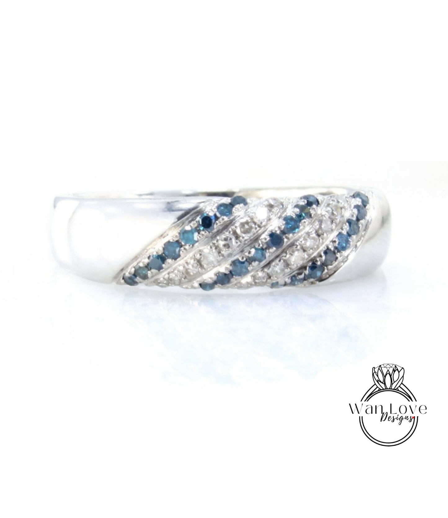 A silver ring with blue and white stones set in a decorative pattern.