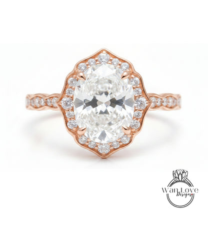 a beautiful diamond engagement ring with a large oval-shaped diamond set in a halo of smaller diamonds, all encircled by a delicate gold band.