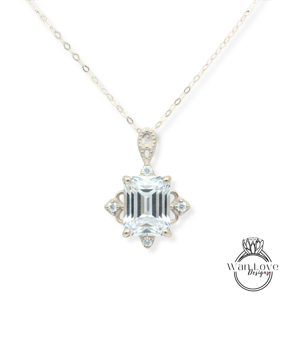 A necklace with a large, clear gemstone pendant.