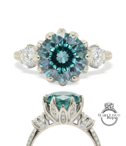 A silver engagement ring with a large blue gemstone, surrounded by smaller diamonds.