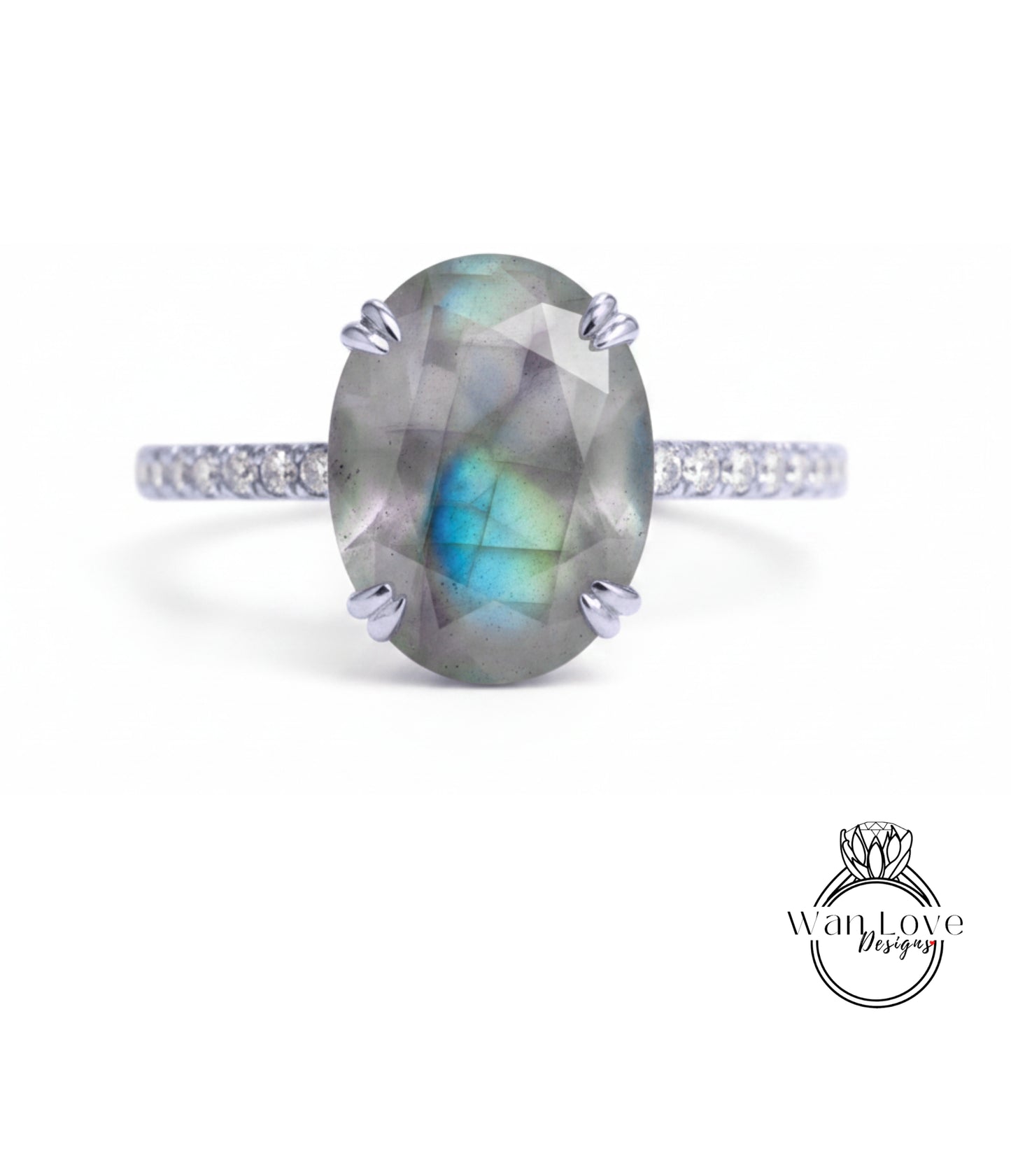 A ring with a large oval-shaped gemstone, possibly a diamond, set in a silver band.