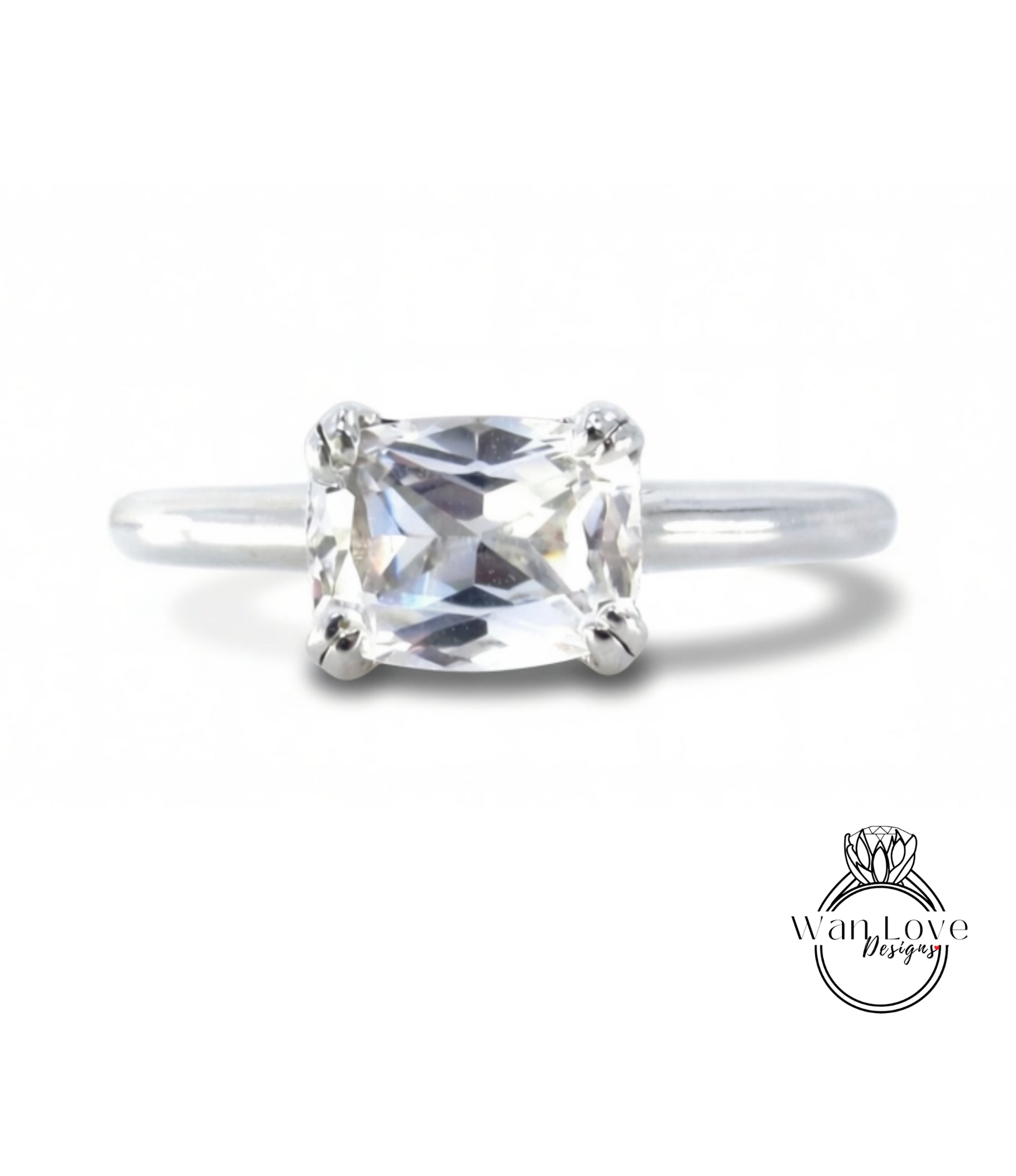 A close-up view of a diamond engagement ring with a large, clear gemstone set in a silver band.