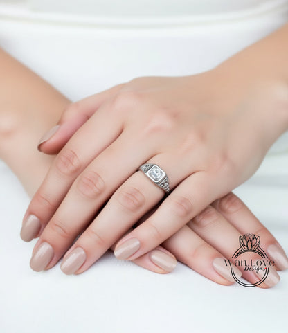 A close-up image of a person's hands with a diamond engagement ring on the ring finger.
