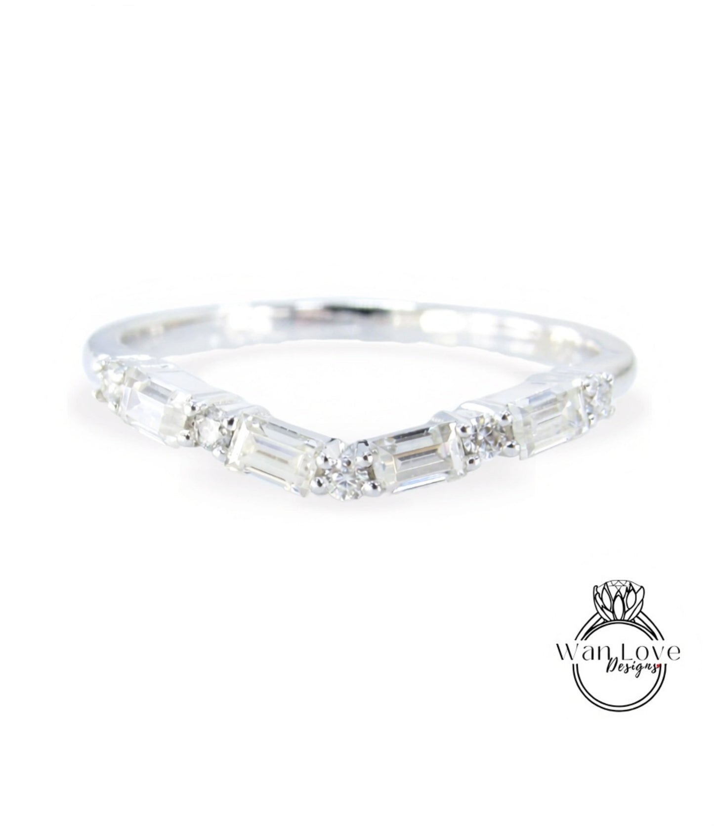 A silver ring with a unique design featuring a series of small diamonds arranged in a curved pattern.