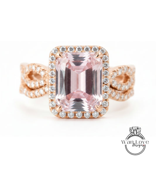 A beautiful pink gemstone ring with a halo of diamonds around it, set in a rose gold band.