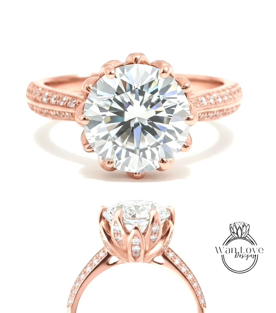 a beautiful rose gold engagement ring with a large, brilliant-cut diamond set in the center. The ring has a scalloped band and is adorned with small diamonds around the band.