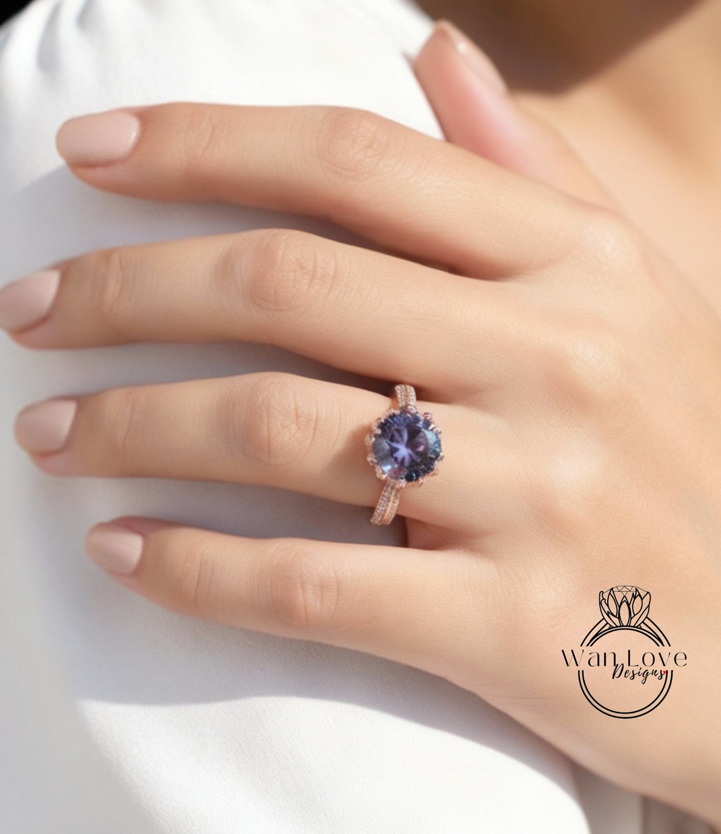 A close-up of a person's hand wearing a ring with a large purple gemstone.