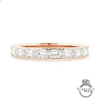 A rose gold band with a row of clear gemstones, likely diamonds, set in the center.