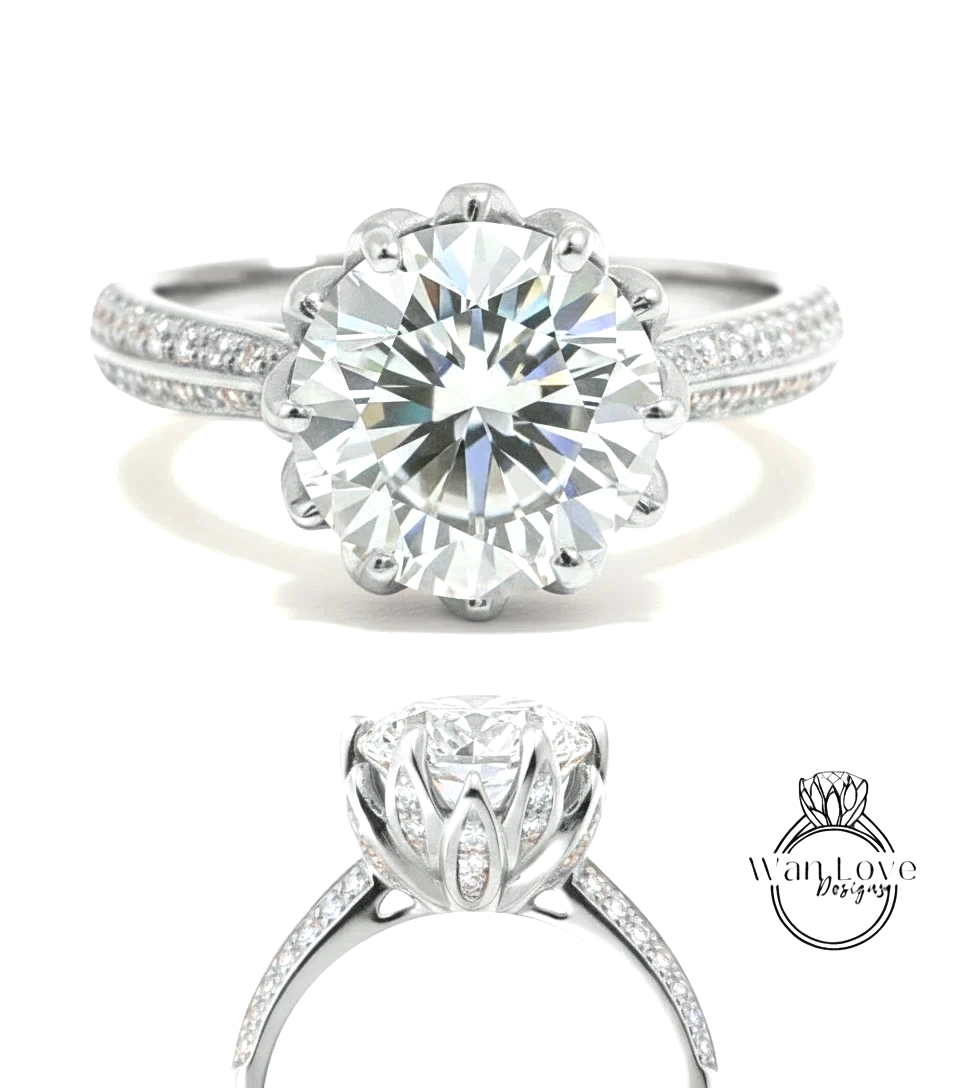 A stunning diamond engagement ring with a large round brilliant cut diamond set in a silver band adorned with small diamonds.