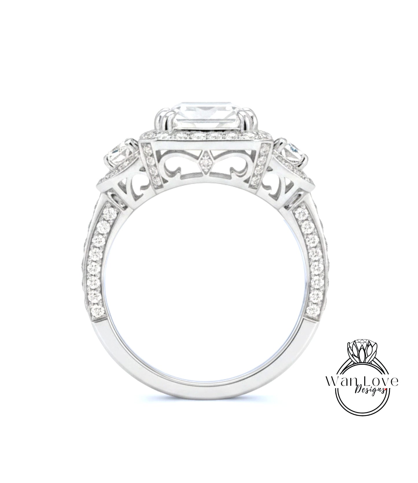 A close-up view of a diamond engagement ring with a large central diamond surrounded by smaller diamonds on either side.