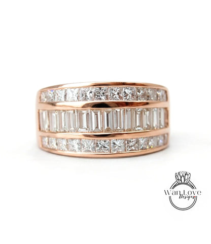 A gold ring with a row of diamonds set in it.