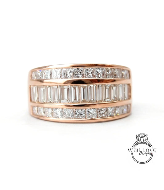 A gold ring with a row of diamonds set in it.