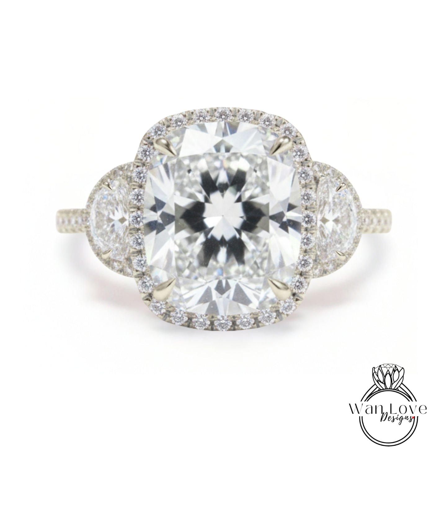 A stunning diamond engagement ring with a large central diamond surrounded by smaller diamonds on either side, set in a halo of smaller diamonds.