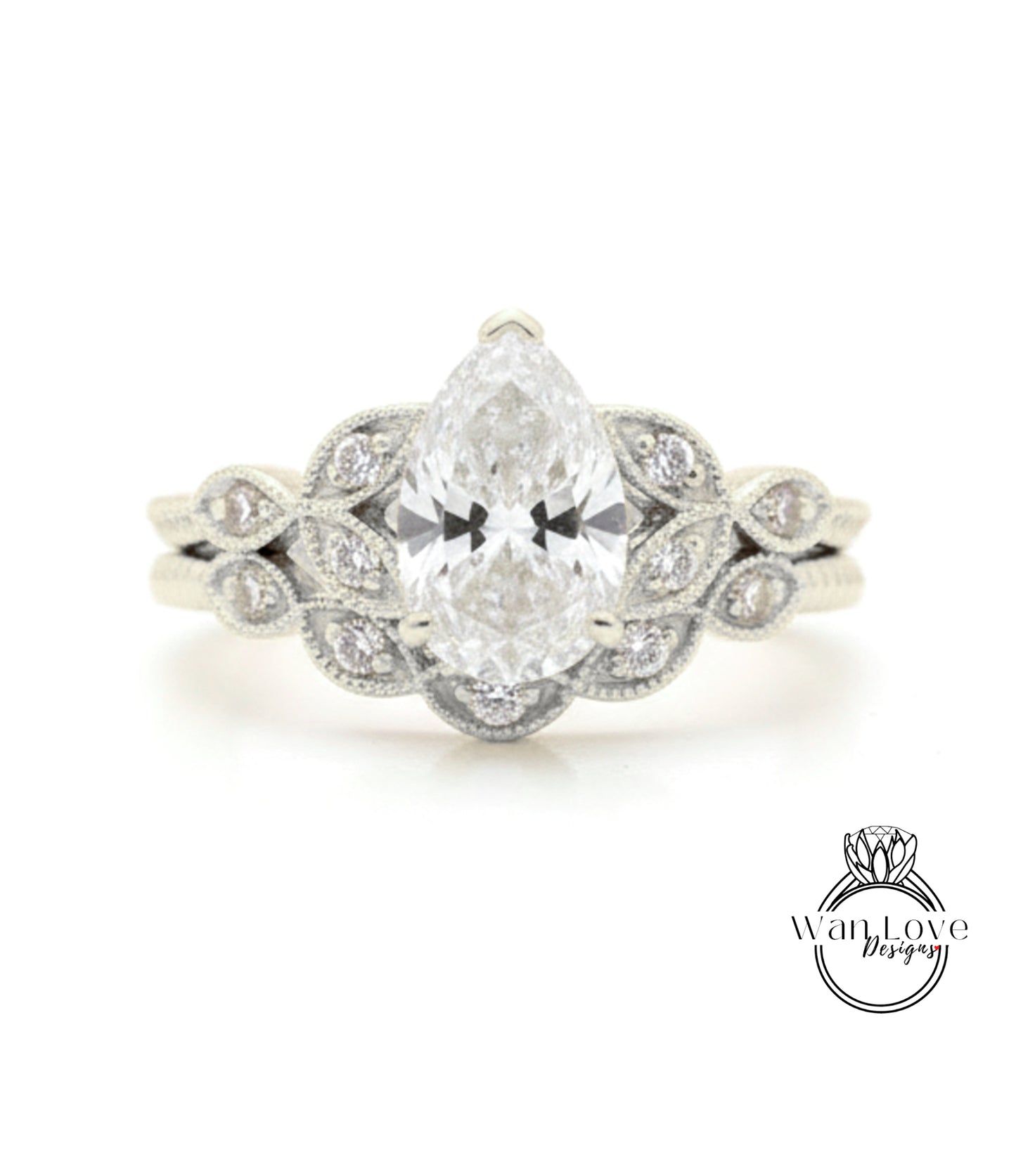 A close-up of a diamond engagement ring with a large central diamond surrounded by smaller diamonds on either side, set in a silver band.