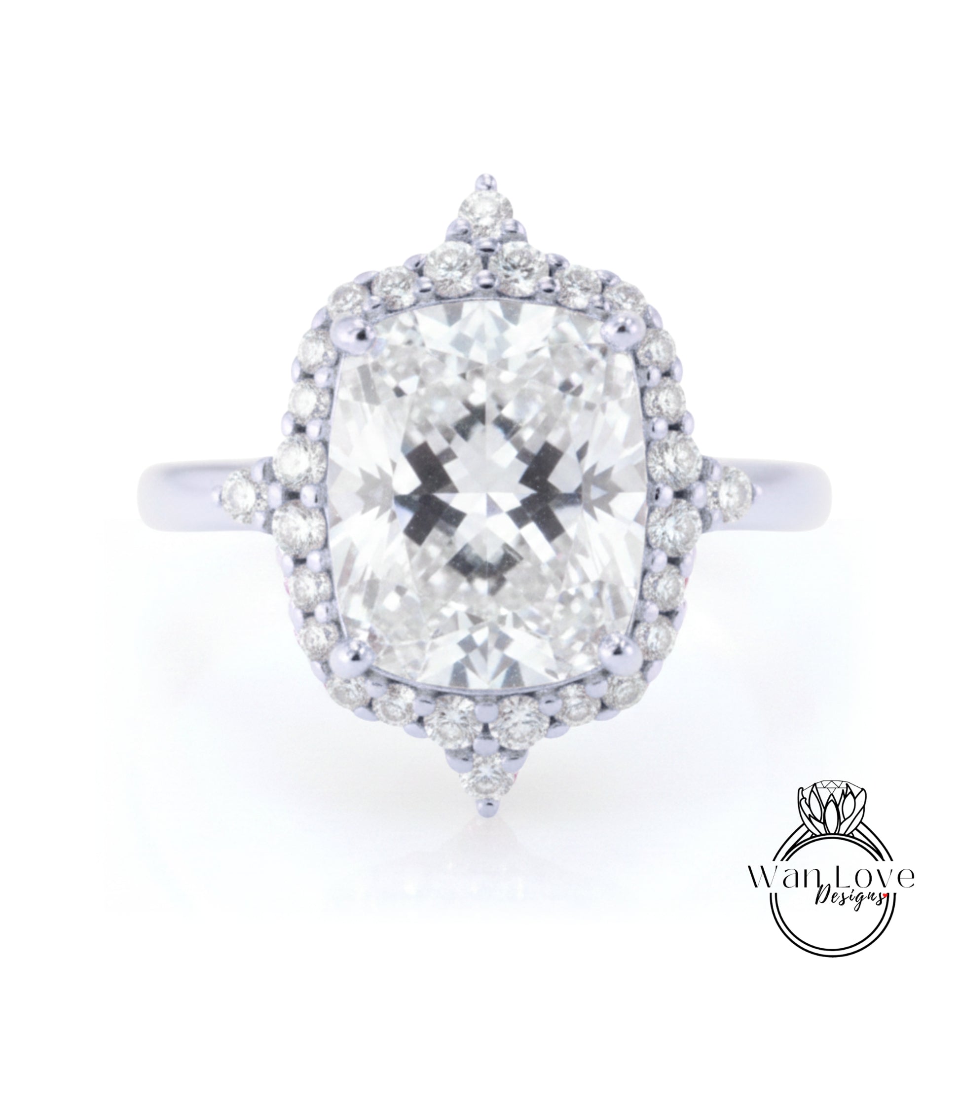 A large, round diamond engagement ring with a halo of smaller diamonds around the center stone.