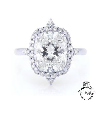 A large, round diamond engagement ring with a halo of smaller diamonds around the center stone.