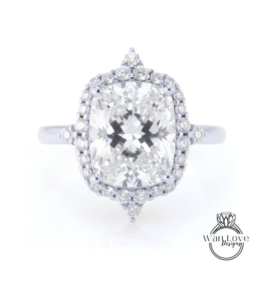 A large, round diamond engagement ring with a halo of smaller diamonds around the center stone.