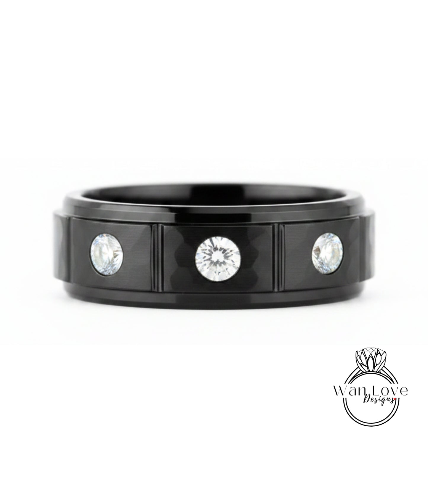 A black ring with three diamonds set in the center.