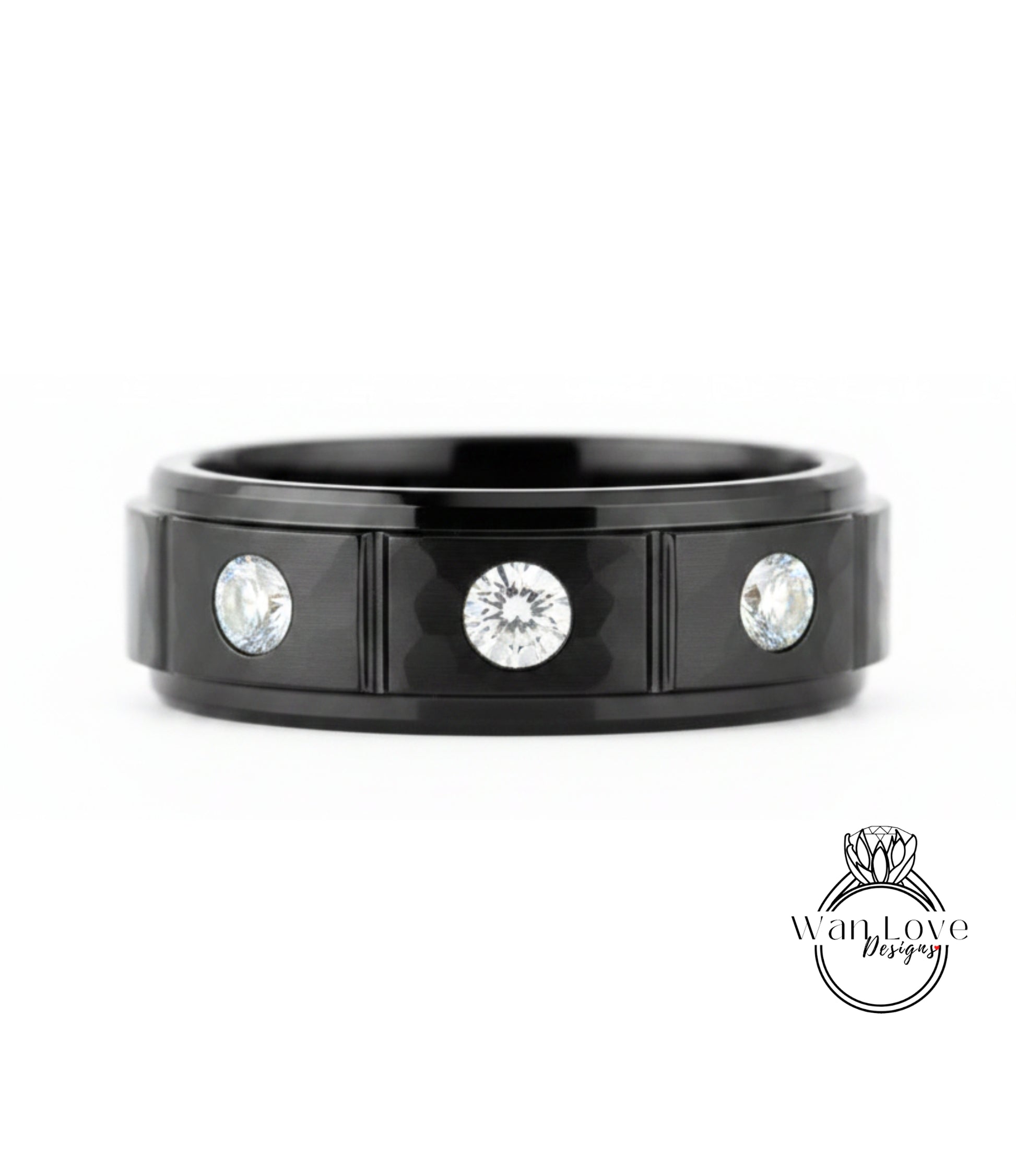 A black ring with three diamonds set in the center.