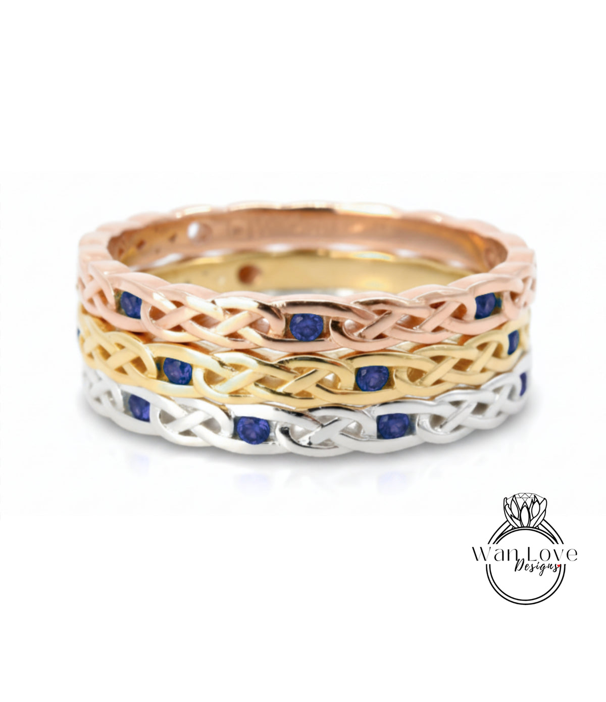 A ring with a Celtic knot design and blue gemstones.
