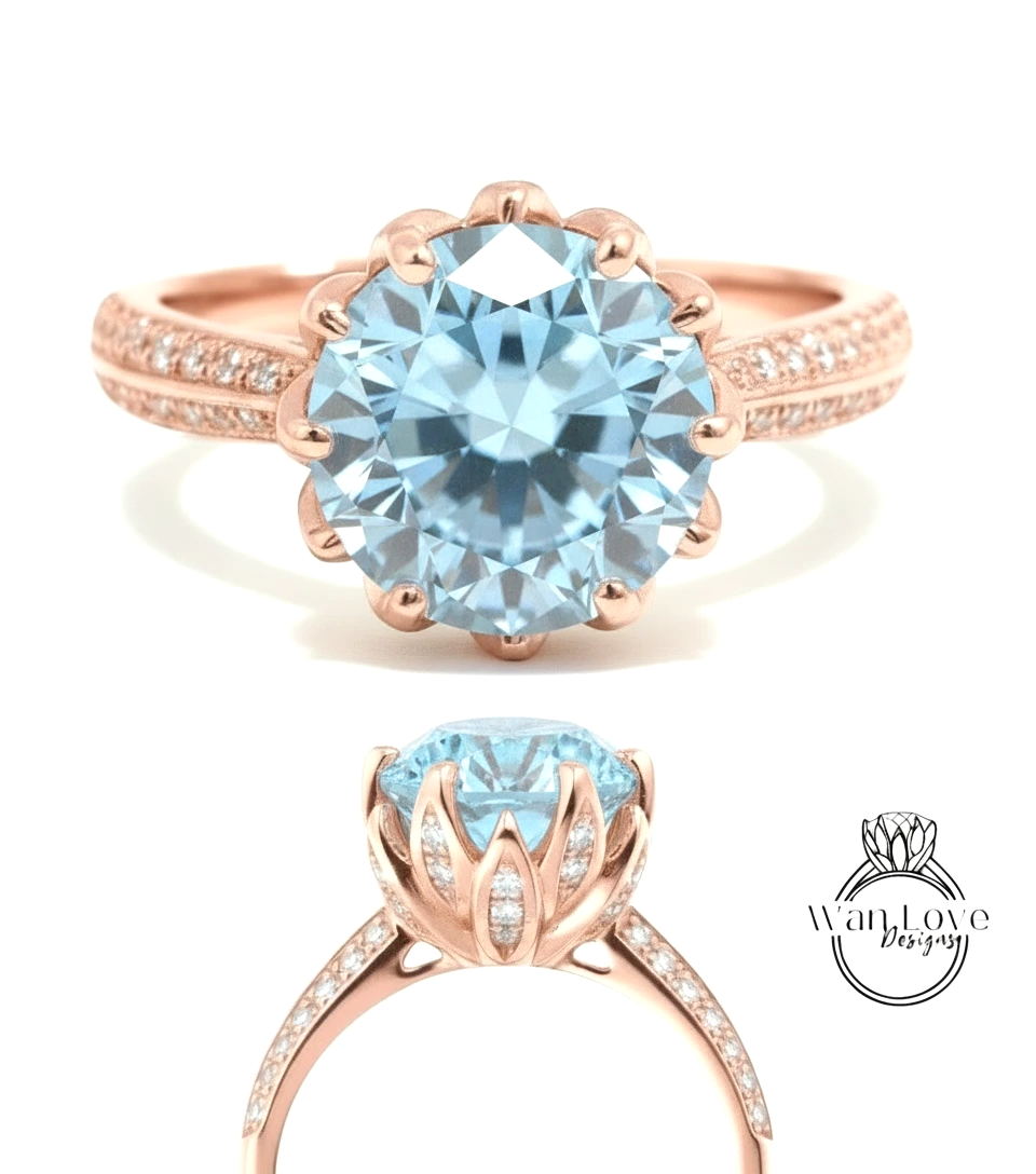 A rose gold ring with a large blue gemstone, likely a diamond, set in a scalloped band.